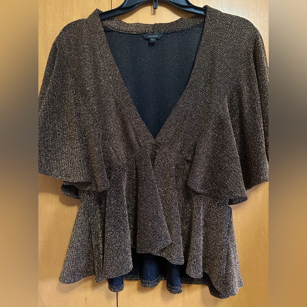 Shimmering gold women’s blouse by Guess in size L.